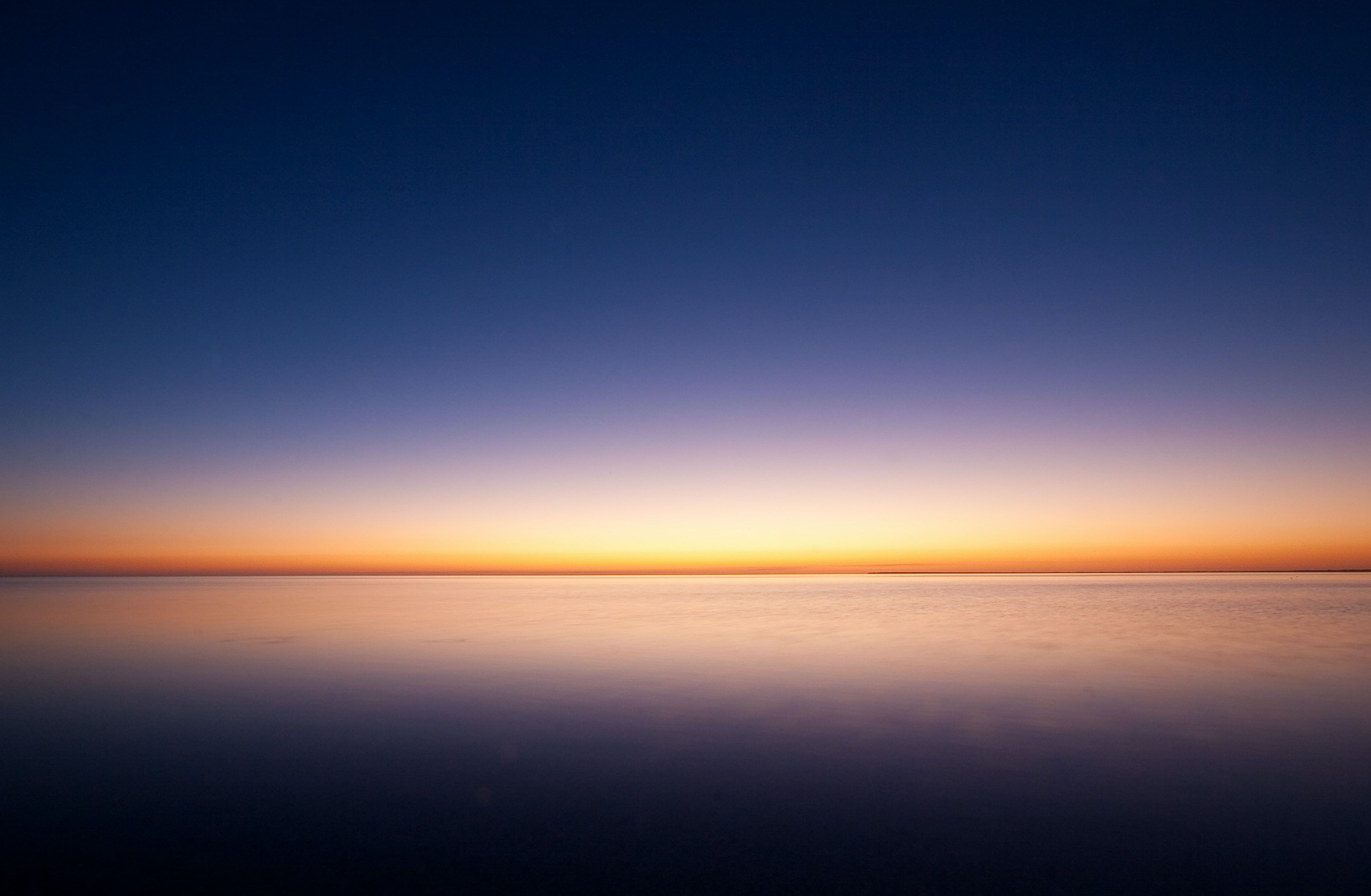 Dawn with sea and blue sky in the horizon