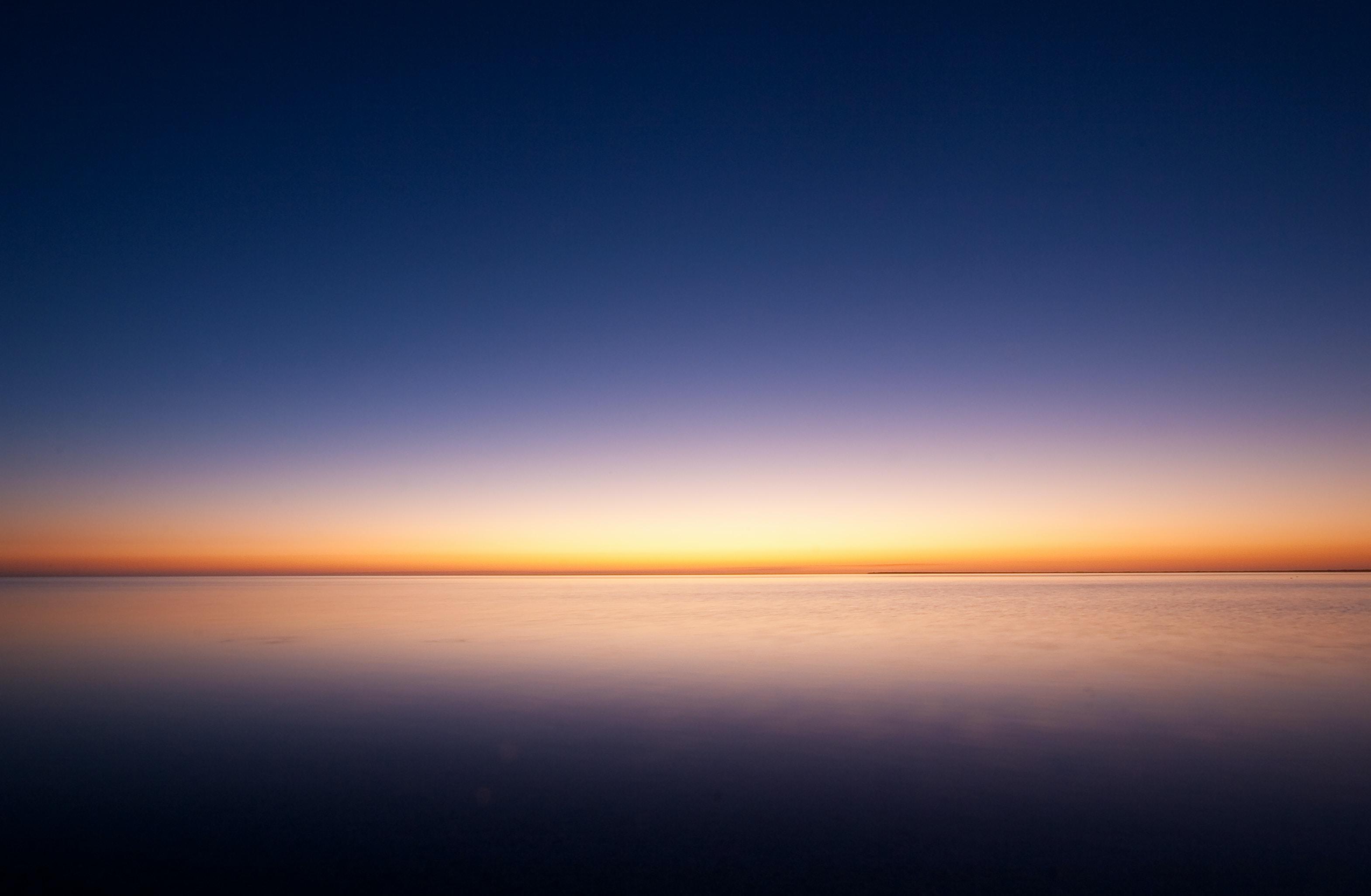 Dawn with sea and blue sky in the horizon